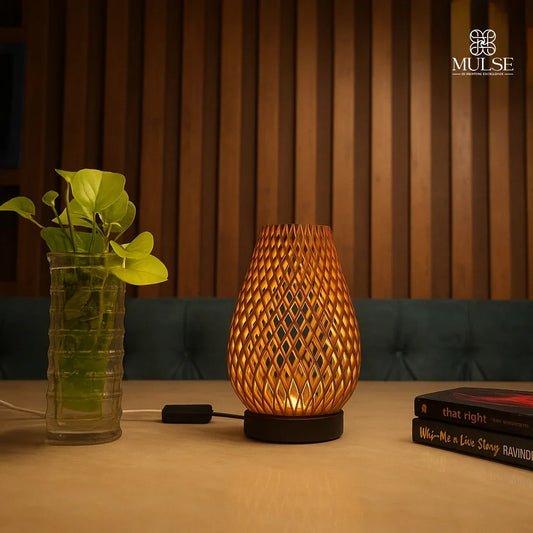 Modern wooden table lamp with geometric lattice design, indoor plant, and books on a table